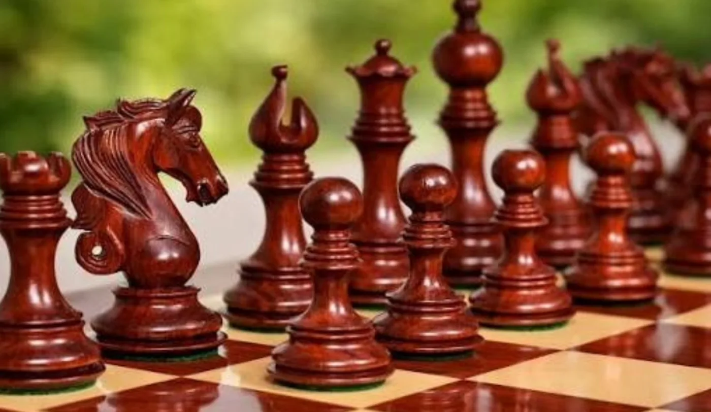 Red sandalwood Intricate Traditional Chess Set & Folding Board from the Arka Crimson catalogue